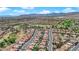Wide aerial shot of a community adjacent to a golf course with mountain views in the distance at 2232 Beacon Ridge Dr, Las Vegas, NV 89134