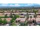 Scenic aerial view of a community featuring well-maintained homes with desert landscaping and tile roofs at 2232 Beacon Ridge Dr, Las Vegas, NV 89134