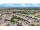 Aerial view of a residential neighborhood and golf course with beautiful desert landscaping and mountain views at 2232 Beacon Ridge Dr, Las Vegas, NV 89134