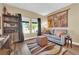 Cozy living room with a comfortable sofa, area rug, and built-in bookshelf at 2232 Beacon Ridge Dr, Las Vegas, NV 89134