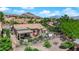 Aerial view of a home with a covered patio, outdoor seating, desert landscaping, and mountain views at 2232 Beacon Ridge Dr, Las Vegas, NV 89134