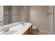 Bright bathroom featuring a double sink vanity, mirror, and a shower-tub combo with tiled walls at 2532 Bechamel Pl, Henderson, NV 89044