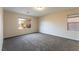 Spacious bedroom with carpet flooring, neutral colors, and natural light at 2532 Bechamel Pl, Henderson, NV 89044