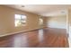 A spacious bonus room featuring hardwood flooring, natural light, and a neutral color palette at 2532 Bechamel Pl, Henderson, NV 89044