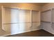 Spacious walk-in closet featuring shelving and metal rods for ample storage capacity at 2532 Bechamel Pl, Henderson, NV 89044