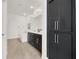 The primary bathroom features dark cabinets, a soaking tub, and linen storage at 2555 Hampton Rd # 10104, Henderson, NV 89052