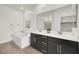 A primary bathroom with double sinks, soaking tub and walk-in shower offers space and convenience at 2555 Hampton Rd # 10104, Henderson, NV 89052