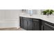 Bathroom showcasing dark cabinets, a white quartz countertop and backsplash, and chrome hardware at 2555 Hampton Rd # 10104, Henderson, NV 89052