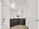 Bathroom featuring dark cabinetry, a tub, a shower and tiled floor at 2555 Hampton Rd # 10104, Henderson, NV 89052