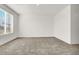 A bright bedroom is carpeted and has a large window that lets in natural light at 2555 Hampton Rd # 10104, Henderson, NV 89052