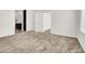 The carpeted bedroom features a large walk-in closet and a doorway to the en-suite bathroom at 2555 Hampton Rd # 10104, Henderson, NV 89052