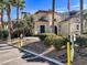 The Clubhouse offers residents a comfortable lounge area, ev charging stations and is framed by palm trees at 2555 Hampton Rd # 10104, Henderson, NV 89052