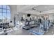 The community gym features modern exercise equipment, ceiling fans, and large windows for a bright workout space at 2555 Hampton Rd # 10104, Henderson, NV 89052
