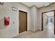 Hallway with unit number 10104 and doors leading to various apartments at 2555 Hampton Rd # 10104, Henderson, NV 89052