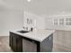 A large kitchen island in a neutral colored room that is brightly lit from natural sunlight at 2555 Hampton Rd # 10104, Henderson, NV 89052