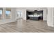 A spacious kitchen with dark cabinets and a kitchen island with modern stainless steel appliances throughout at 2555 Hampton Rd # 10104, Henderson, NV 89052