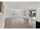 Bright living room with wood flooring, large windows and access to a patio at 2555 Hampton Rd # 10104, Henderson, NV 89052