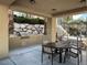 Cozy outdoor kitchen and dining area with a built-in grill and a shaded seating area at 2555 Hampton Rd # 10104, Henderson, NV 89052