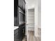 Walk-in pantry featuring stainless appliances and black cabinets at 2555 Hampton Rd # 10104, Henderson, NV 89052