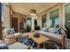 Outdoor patio with comfortable seating, stylish rug and overhead lighting perfect for relaxing at 2555 Hampton Rd # 10104, Henderson, NV 89052