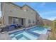 Backyard oasis featuring a pool, hot tub, and patio area at 272 Mount Steele Ave, Henderson, NV 89015