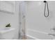 Toilet and bathtub with white tile in a bright bathroom with a white blind at 272 Mount Steele Ave, Henderson, NV 89015