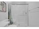 Bathroom shower with seat, cactus curtain and white subway tile at 272 Mount Steele Ave, Henderson, NV 89015