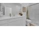 Bathroom with white cabinets, shower and plant at 272 Mount Steele Ave, Henderson, NV 89015