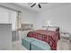 Bright bedroom featuring a ceiling fan, window, and closet with shelving at 272 Mount Steele Ave, Henderson, NV 89015