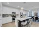 Contemporary kitchen with a large island, stainless steel appliances, white cabinetry, and decorative backsplash at 272 Mount Steele Ave, Henderson, NV 89015