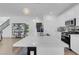 Bright kitchen with a spacious island, stainless steel appliances, and elegant backsplash detail above the stove at 272 Mount Steele Ave, Henderson, NV 89015