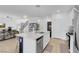Open-concept kitchen featuring a large center island, stainless steel appliances, and modern pendant lighting at 272 Mount Steele Ave, Henderson, NV 89015