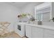 Well-equipped laundry room with washer, dryer, and counter space at 272 Mount Steele Ave, Henderson, NV 89015