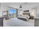 Bright main bedroom features a walkout balcony, ceiling fan, and gray wood furnishings at 272 Mount Steele Ave, Henderson, NV 89015