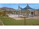 Neighborhood park featuring playground with play equipment, picnic tables and shade at 272 Mount Steele Ave, Henderson, NV 89015