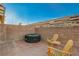 Relaxing backyard featuring comfortable chairs and a hot tub, perfect for enjoying outdoor activities at 2852 Red Ct, Las Vegas, NV 89123