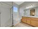 Bright bathroom featuring a walk-in shower, soaking tub, and double vanity at 2852 Red Ct, Las Vegas, NV 89123
