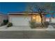 Charming single-story home with a well-maintained garage, lush landscaping, and inviting curb appeal at 2852 Red Ct, Las Vegas, NV 89123
