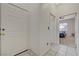 Hallway with tile flooring leading to the front door and a bedroom at 2852 Red Ct, Las Vegas, NV 89123