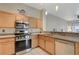 Well-equipped kitchen with stainless steel appliances, granite countertops, and a stylish, functional design at 2852 Red Ct, Las Vegas, NV 89123