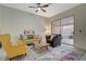 Cozy living room featuring tile flooring, comfortable seating, and a sliding glass door to the outdoor space at 2852 Red Ct, Las Vegas, NV 89123