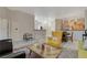 Open-concept living area with tile floors, a stylish mix of furniture, and easy access to the kitchen at 2852 Red Ct, Las Vegas, NV 89123