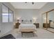 Bright main bedroom with large window and mirrored closet doors at 2852 Red Ct, Las Vegas, NV 89123