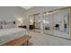 Well-lit main bedroom with mirrored closet doors and a ceiling fan at 2852 Red Ct, Las Vegas, NV 89123