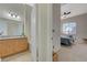 View into the bedroom and en-suite bathroom with double sinks and a soaking tub at 2852 Red Ct, Las Vegas, NV 89123
