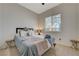 Bright bedroom features a large window and neutral decor at 2852 Red Ct, Las Vegas, NV 89123