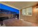 Covered patio features brick privacy wall and view into the adjacent bedroom with a queen-sized bed at 2852 Red Ct, Las Vegas, NV 89123