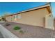 Single-story home with desert landscaping and an access gate between the house and the brick wall at 2852 Red Ct, Las Vegas, NV 89123