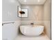 Bathroom featuring a soaking tub and sleek, modern fixtures and art at 3750 Las Vegas Blvd # 2407, Las Vegas, NV 89158