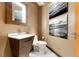Contemporary powder room with floating vanity and decorative wall art at 3750 Las Vegas Blvd # 2407, Las Vegas, NV 89158